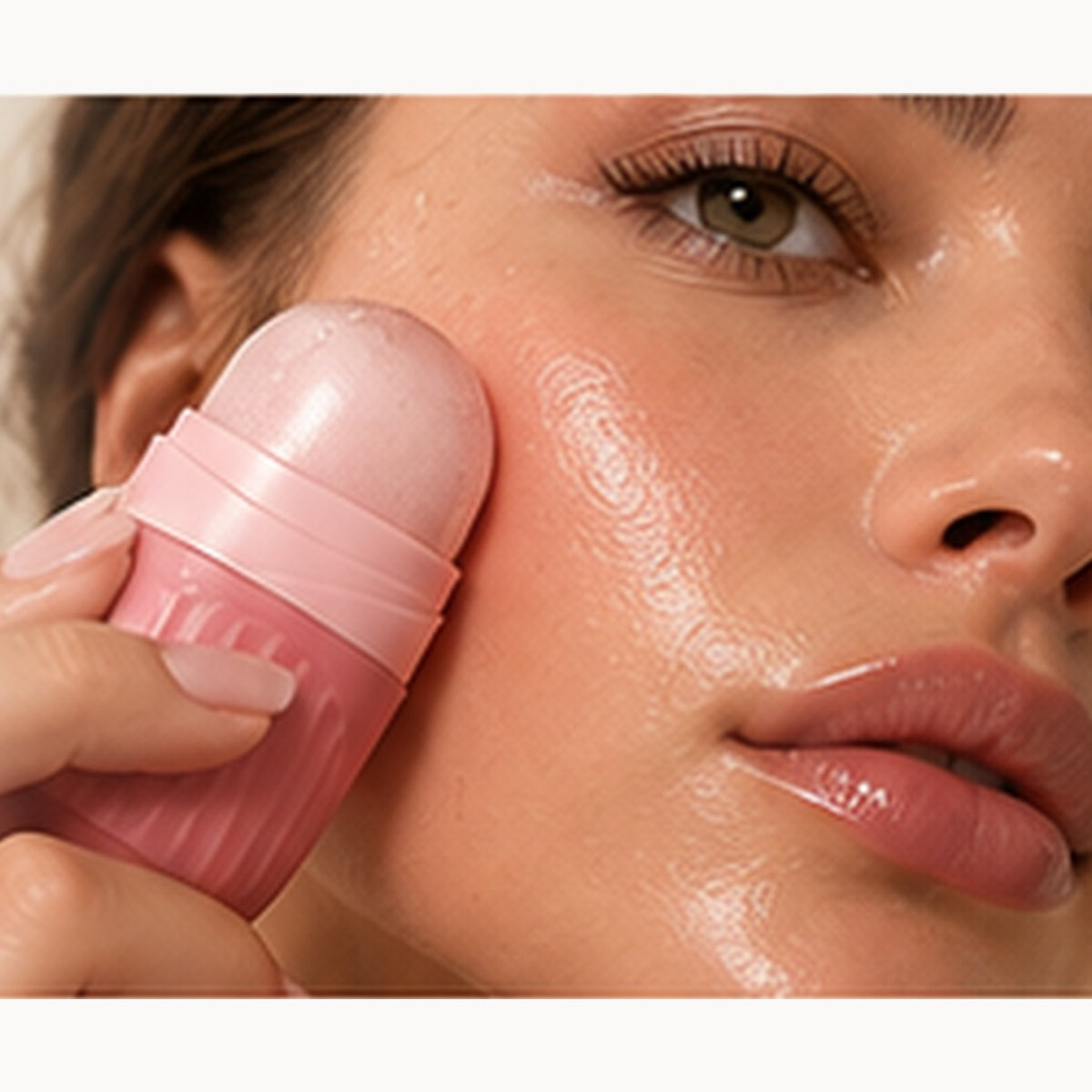 Woman applying Virelle Glow Collagen Glow Balm to cheek