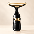 The Sculpt Wand black and champagne-gold beauty instrument