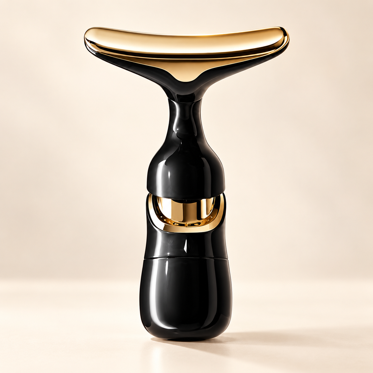 The Sculpt Wand black and champagne-gold beauty instrument
